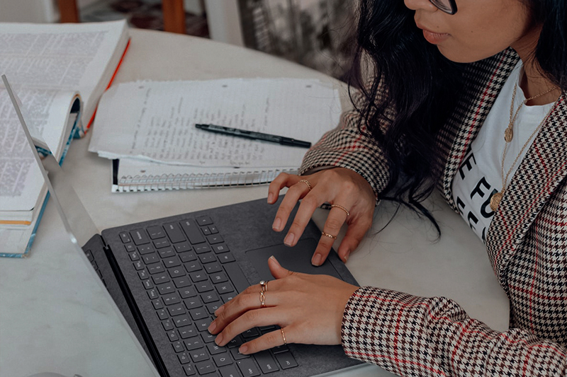 Person at desk using grey computer